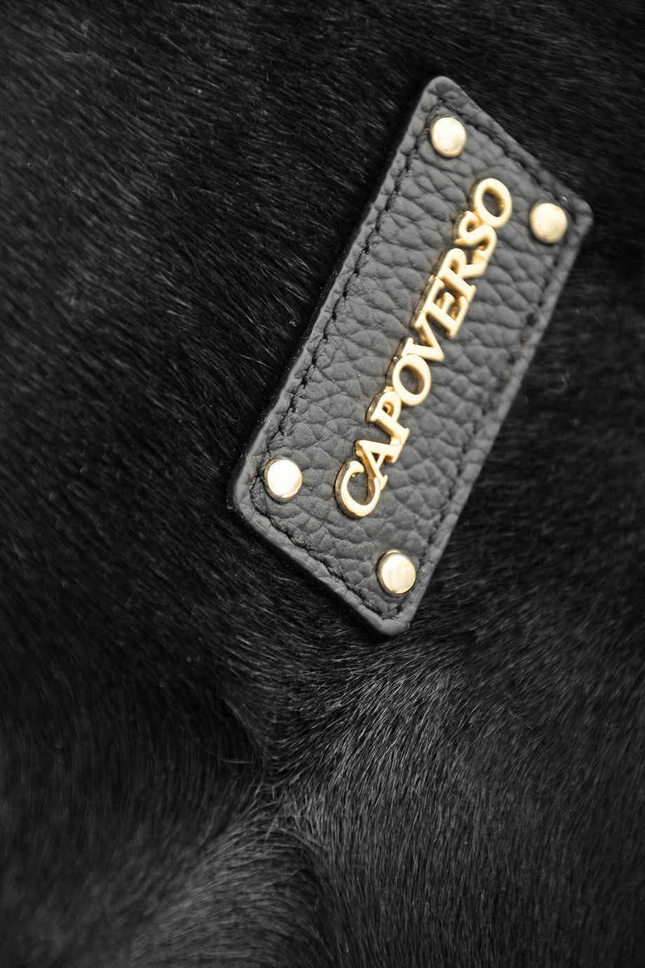 CAPOVERSO CAVALLINO Zwarte leren tas met ponyhaar